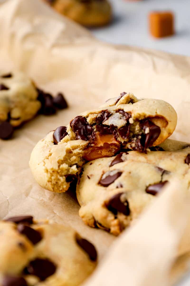 chocolate cookies torn apart to reveal caramel in the middle