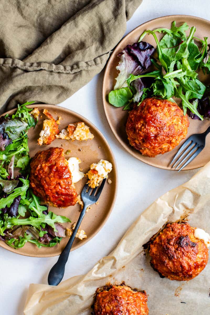 dinner plates with mini meatloaves and greens