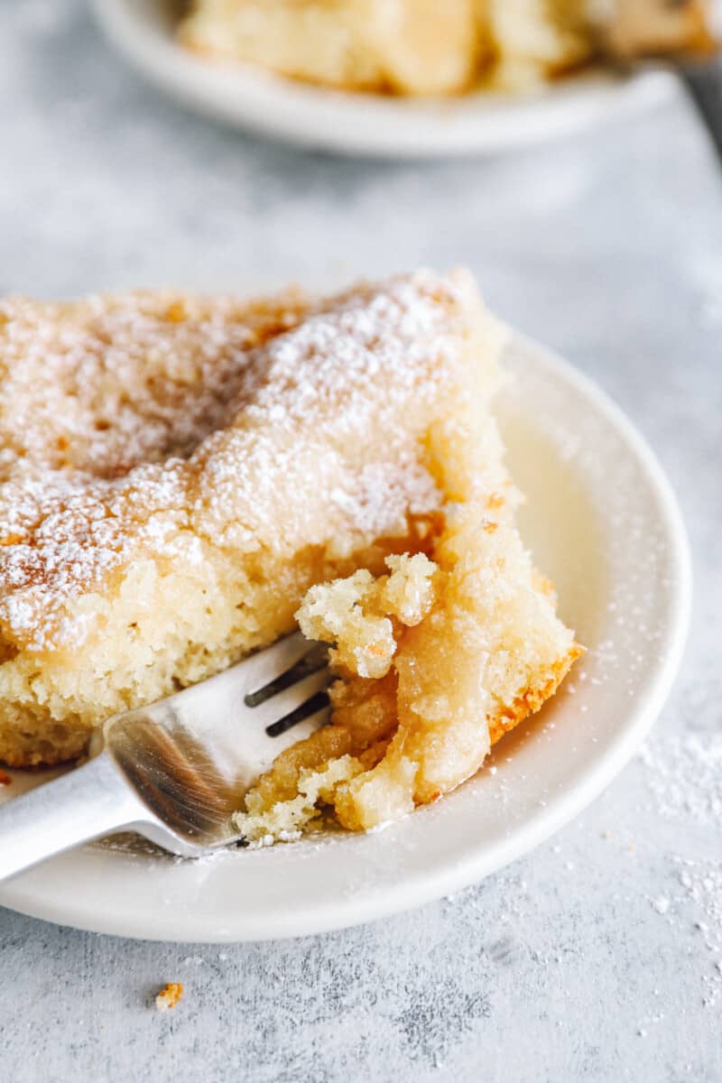 close up on a fork slicing into a piece of cake