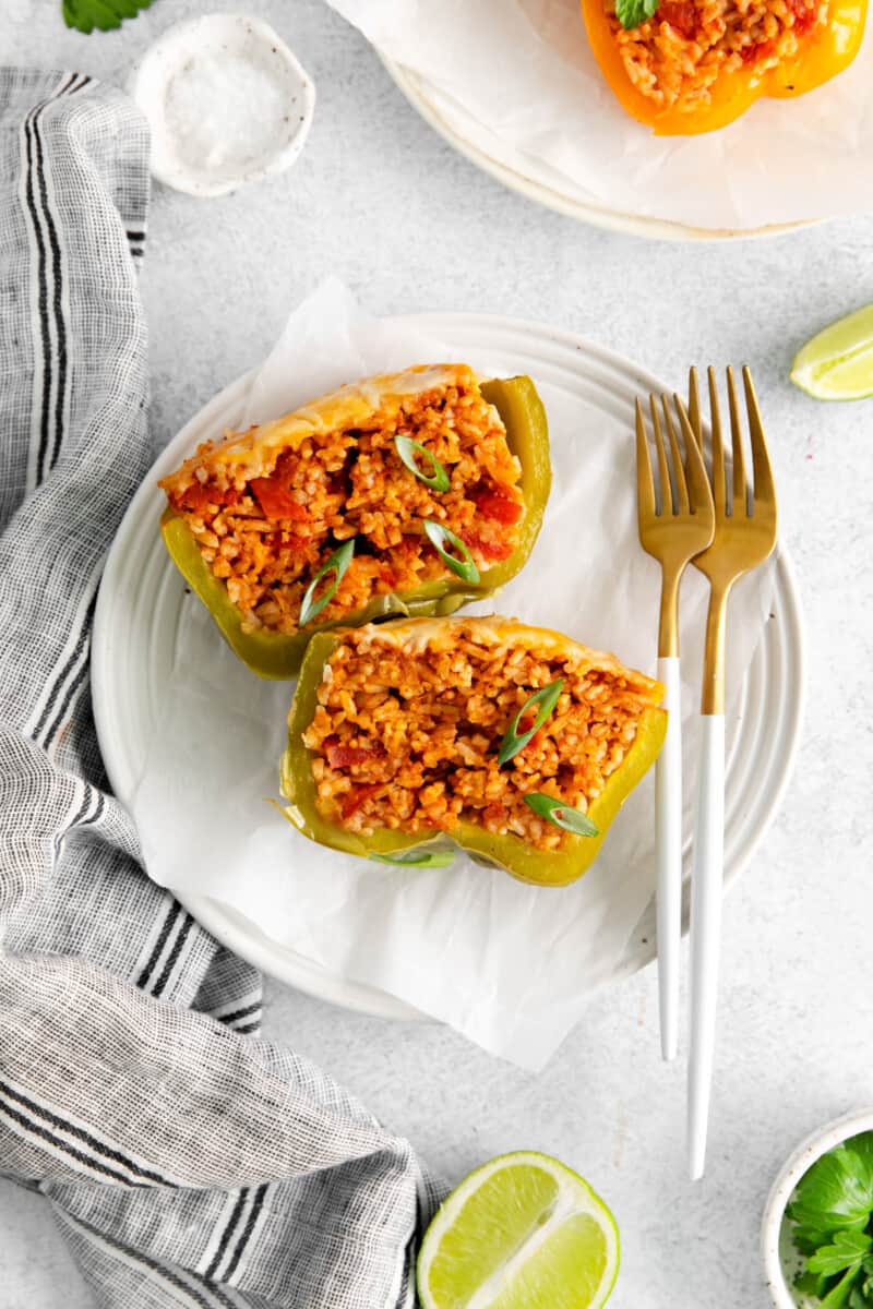 overhead view of a halved instant pot stuffed pepper on a white plate.