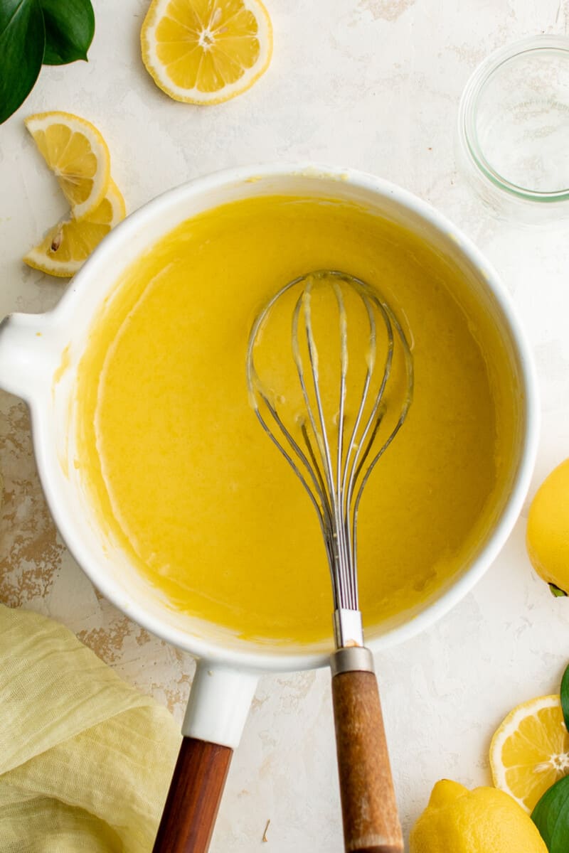 whisking ingredients in a pot