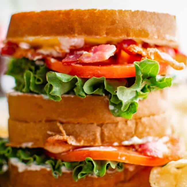 close up of 2 stacked blt sandwiches.