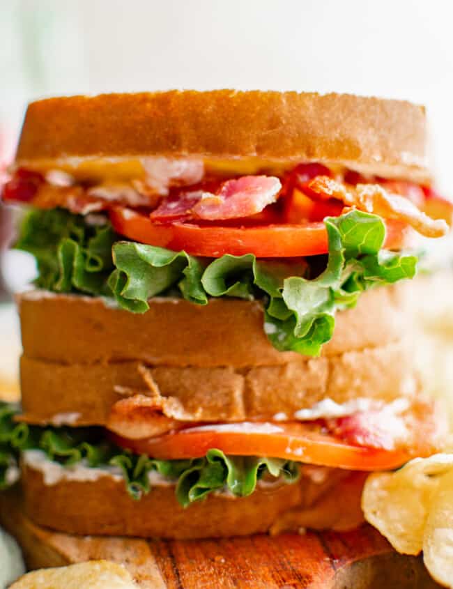 close up of 2 stacked blt sandwiches.