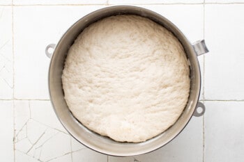 bread dough rising in a bowl