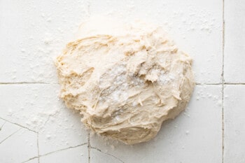 forming bread dough on a countertop