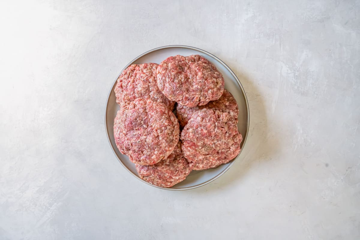 breakfast burger patties on a gray plate.