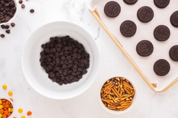 bowls of chocolate chips and pretzel sticks