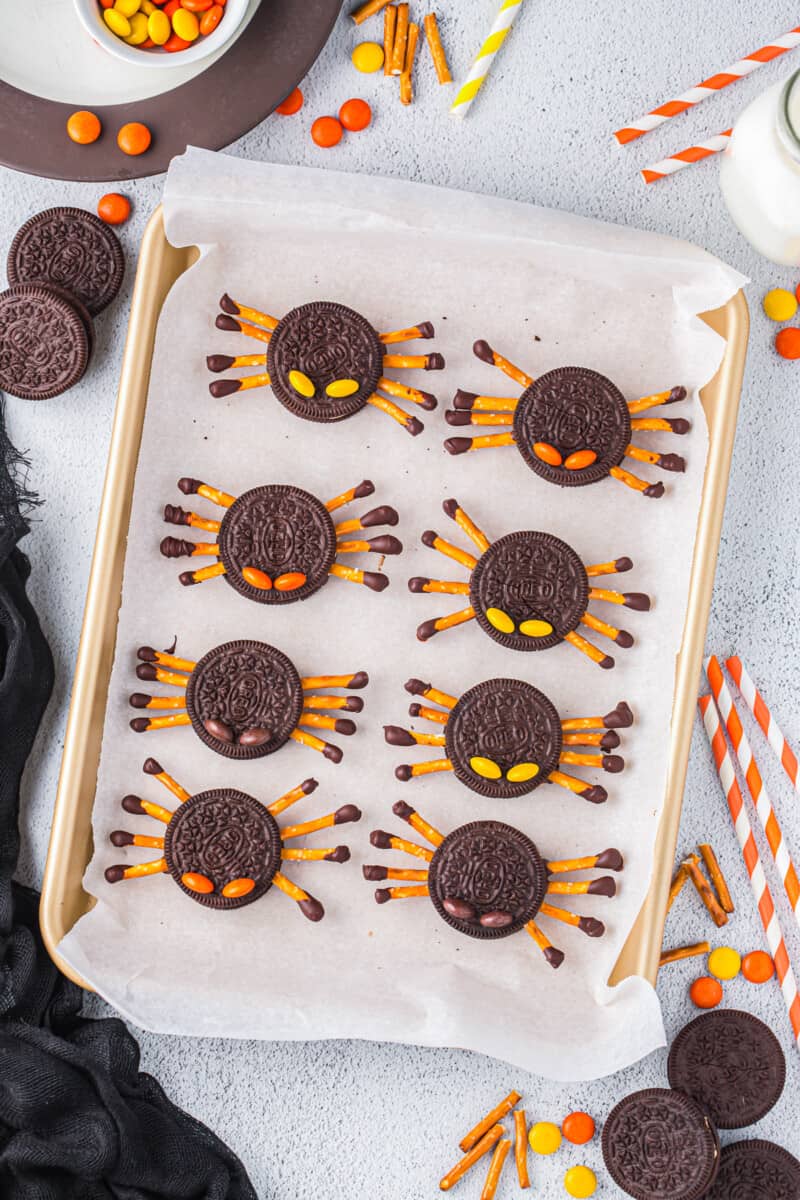 8 oreo spiders arranged on a baking tray