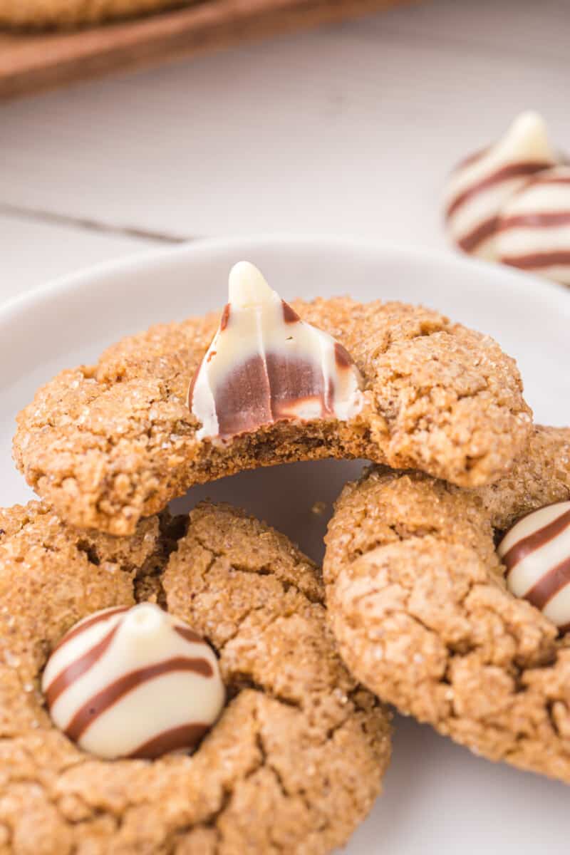 gingerbread blossoms on a plate, one has a bite taken out