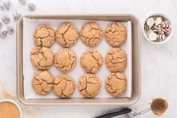 gingerbread cookies lined up on a baking sheet