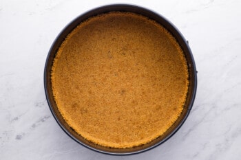 graham cracker crust pressed into round cake pan