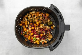 roasted veggies in the basket of an air fryer