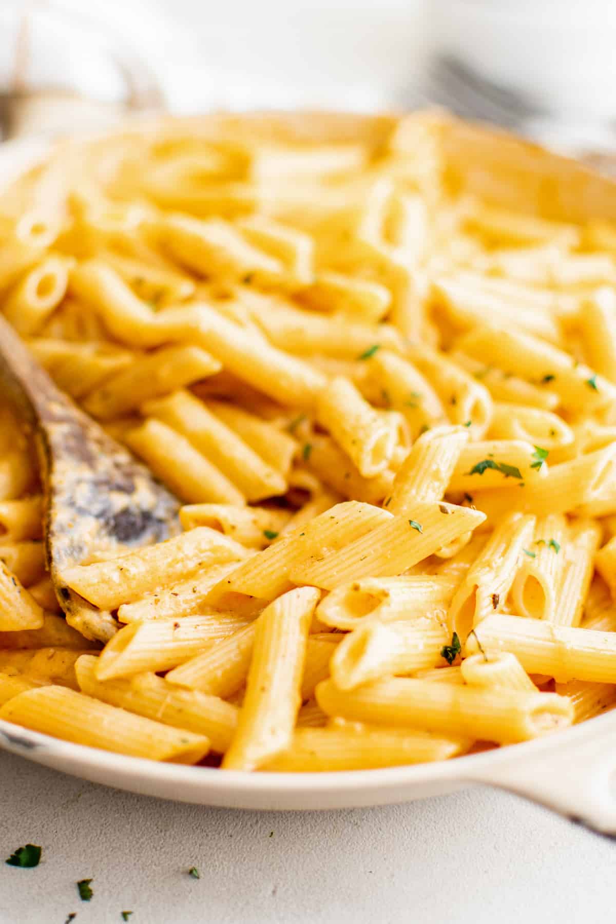 large serving bowl full of penne alla vodka pasta