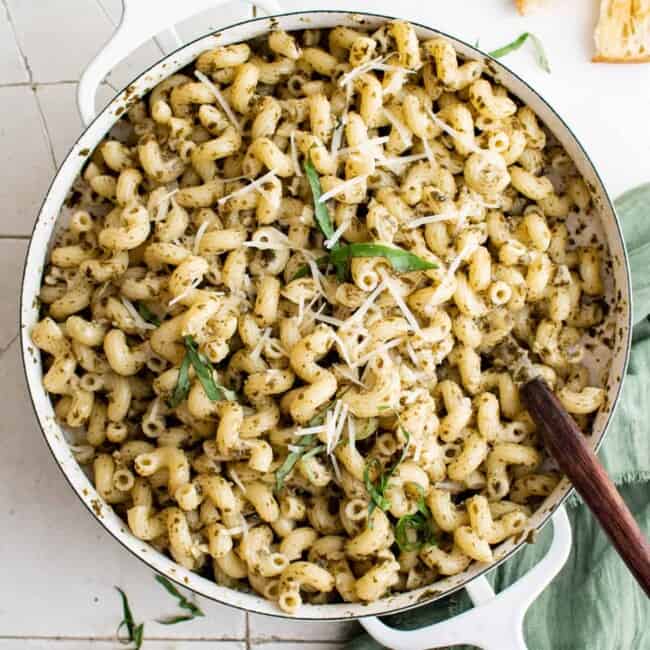 overhead view of a pot full of pesto cavatappi pasta