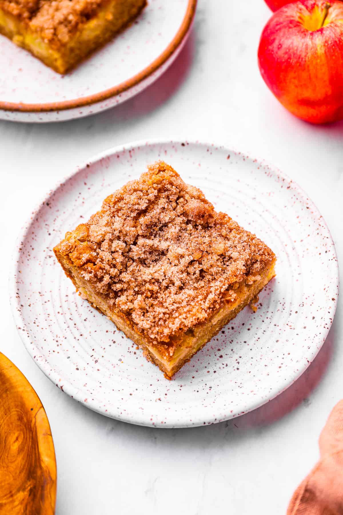 a square slice of cinnamon apple cake