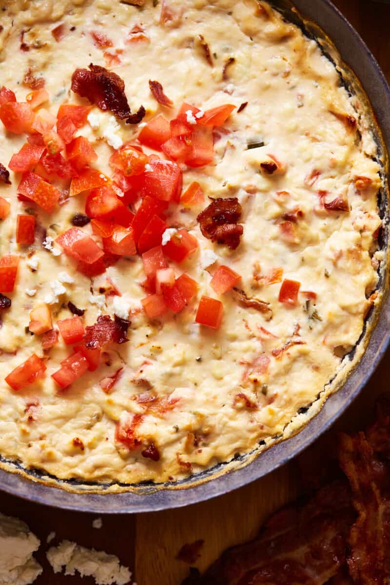 creamy bacon feta dip topped with diced tomatoes