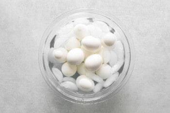 boiled eggs cooling in an ice bath