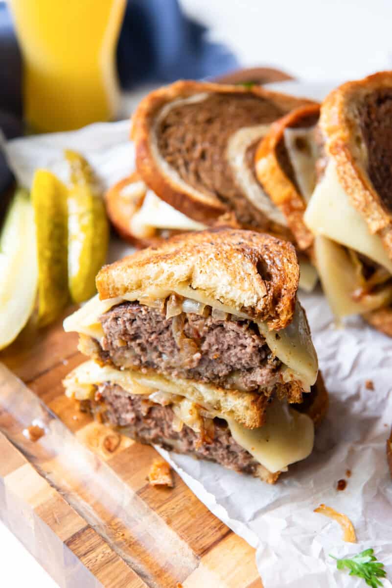 patty melt cut in half and stacked up