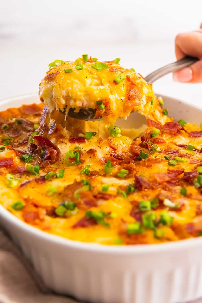 scooping a serving of twice baked potato casserole