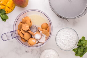 nilla wafers, sugar, and butter in a food processor.