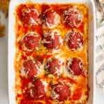 overhead view of meatball casserole in a white baking pan.