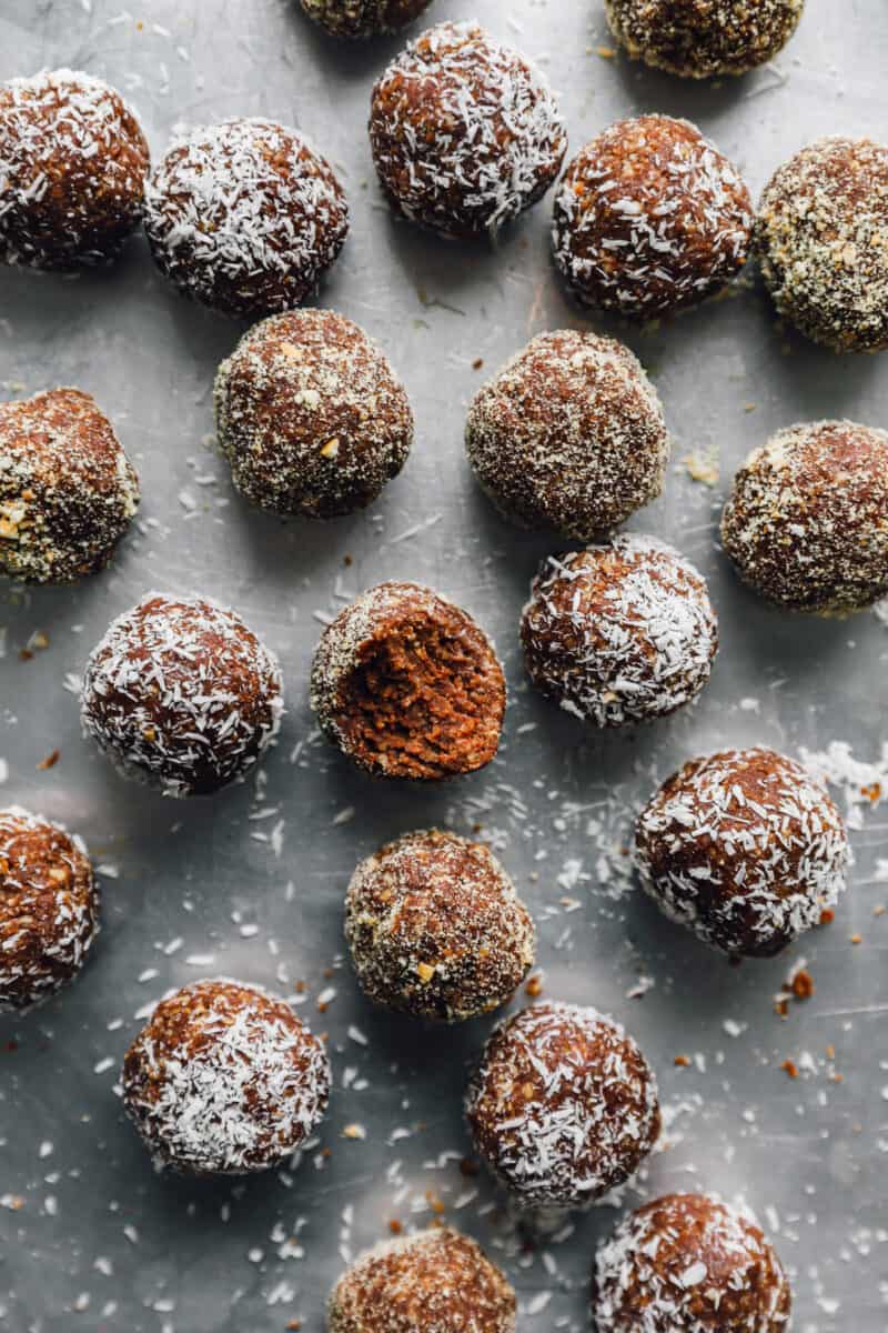 a bitten rum ball in a sea of rum balls.