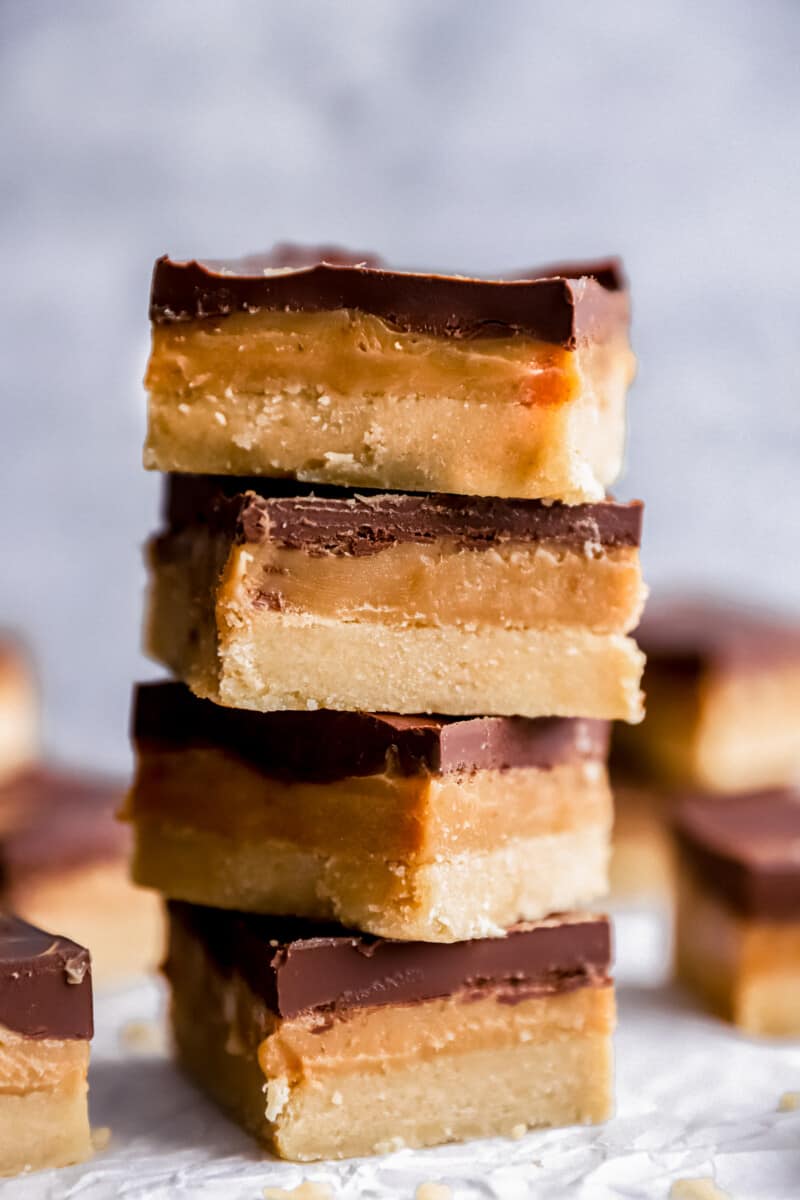 4 stacked millionaire shortbread bars.