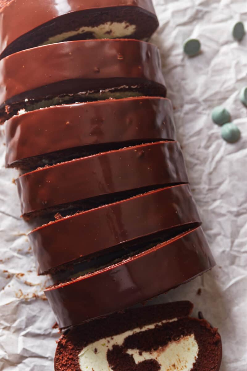 mint chocolate Swiss roll on wax paper