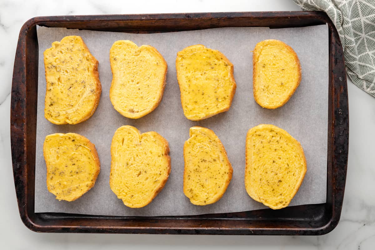 8 slices of texas toast on a baking sheet.