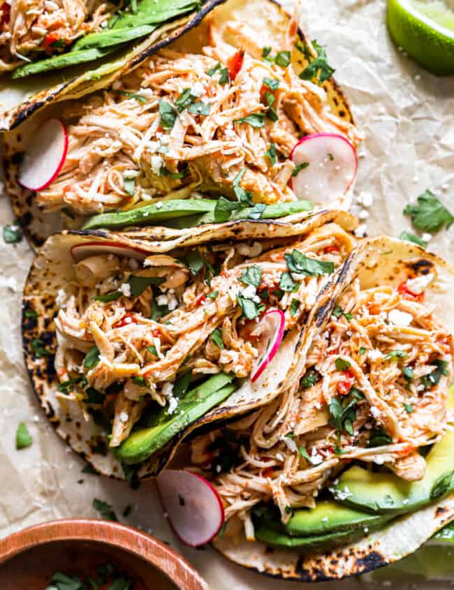 overhead view of 4 crockpot chicken tacos.