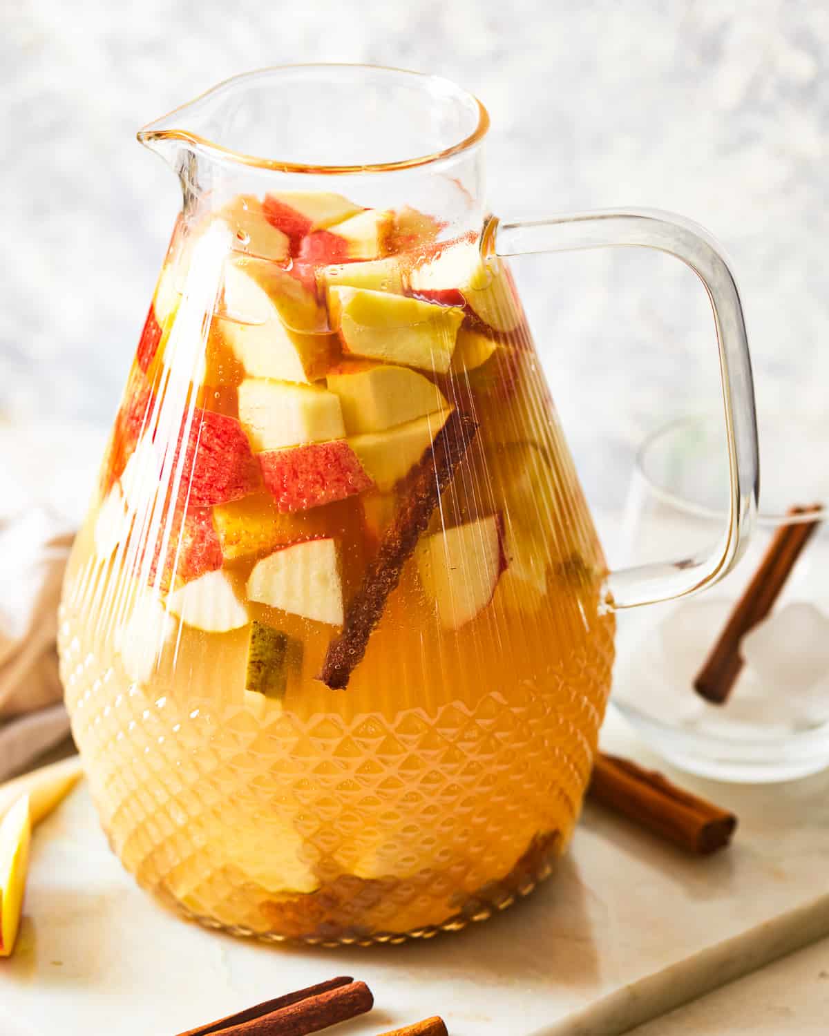 a pitcher of caramel apple sangria