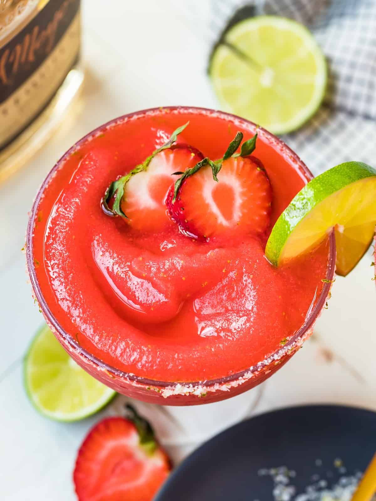 overhead image of frozen strawberry margarita in glass