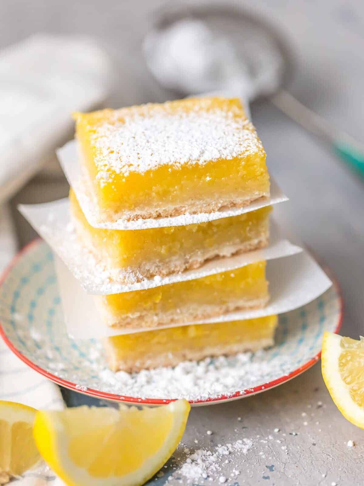 stacked lemon squares with powdered sugar