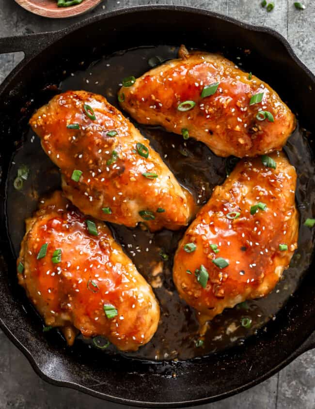 asian chicken breasts in a cast iron skillet.