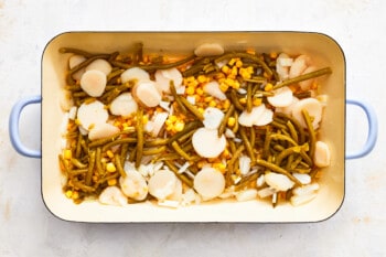 green beans, corn, and water chestnuts layered in a casserole dish