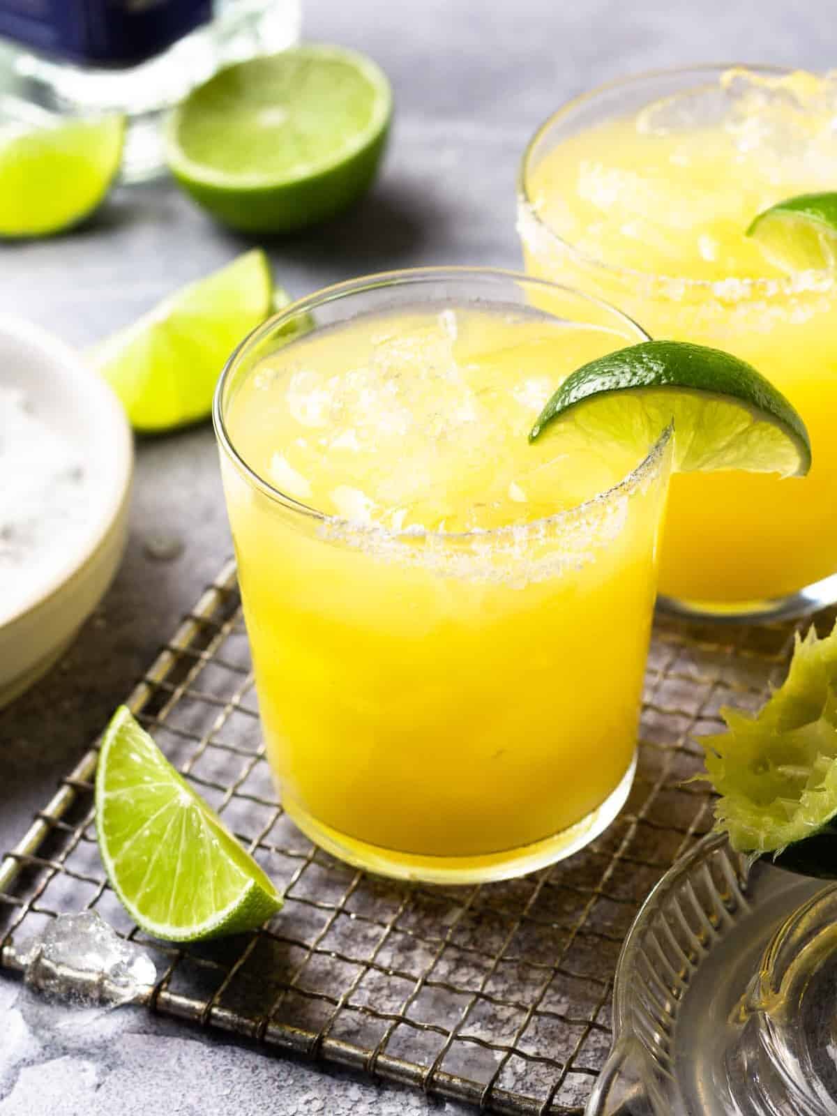 a skinny margarita in a rocks glass with a lime wedge.