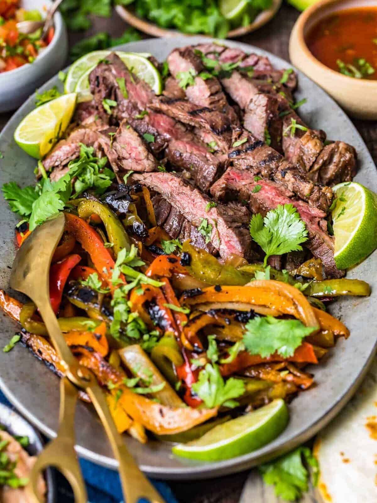 a plate of steak fajitas