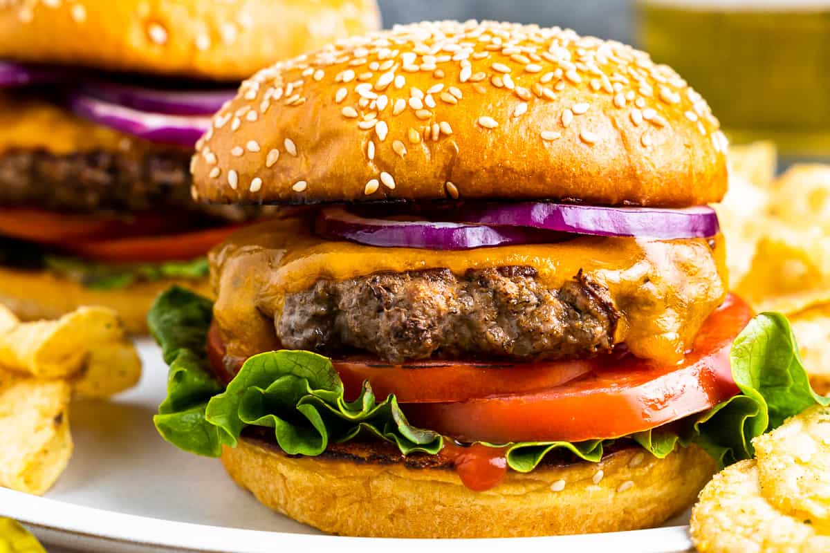 stovetop hamburgers on a plate with potato chips