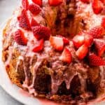 side shot of strawberry pound cake with strawberry glaze