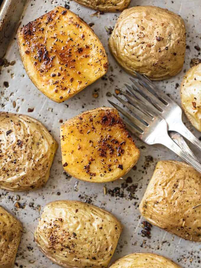 close up view of herbs on herb roasted potatoes