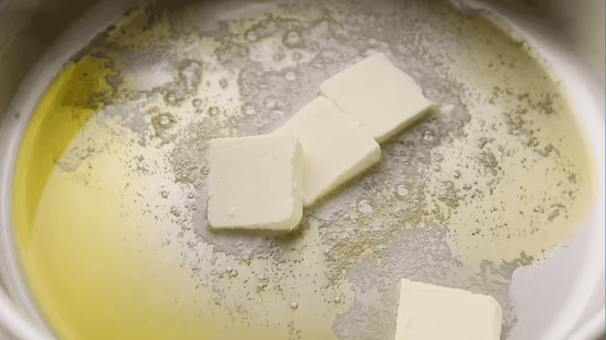 melting butter and oil in a skillet.