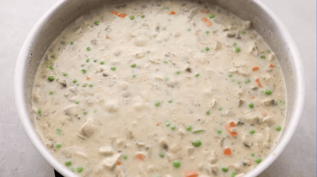 creamy seasoned chicken pot pie filling in a pan.