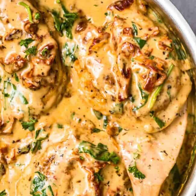 up close image of tuscan chicken in parmesan cream sauce