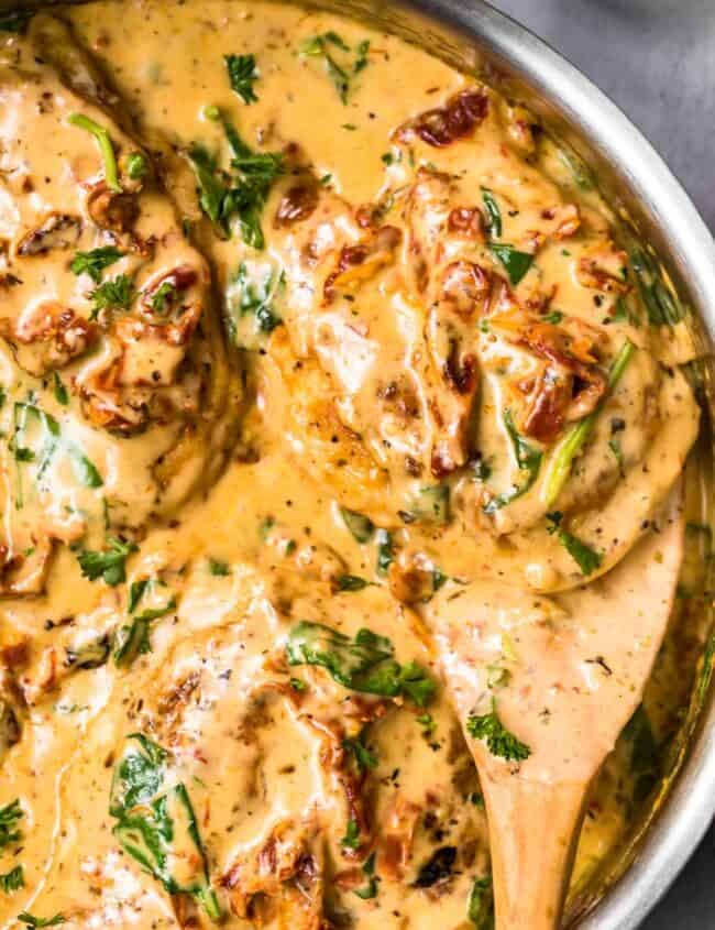 up close image of tuscan chicken in parmesan cream sauce