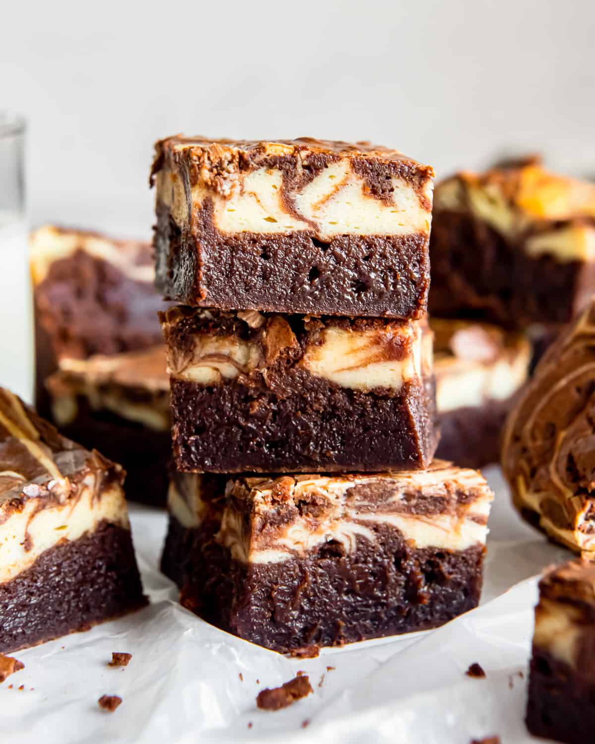 side view of 3 stacked cream cheese brownies.