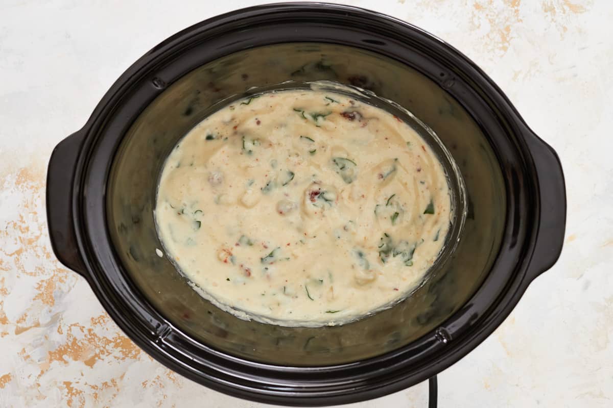 Alfredo ingredients in a crockpot.