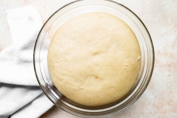 a loaf of bread in a glass baking dish.