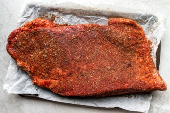 a piece of meat on a baking sheet.