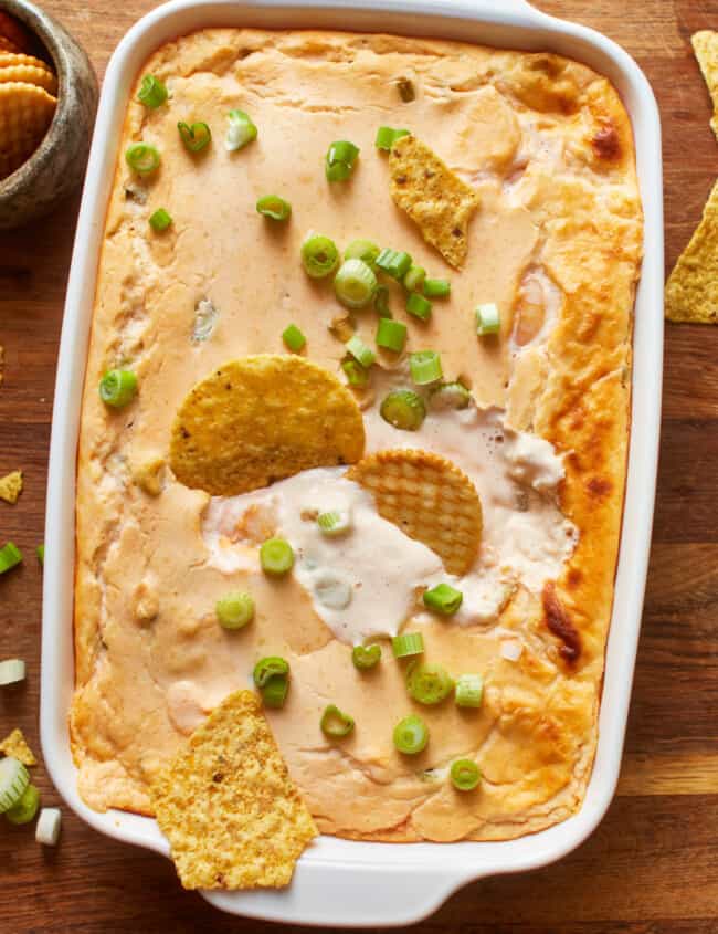 close up overhead view of shrimp dip in a white baking pan.