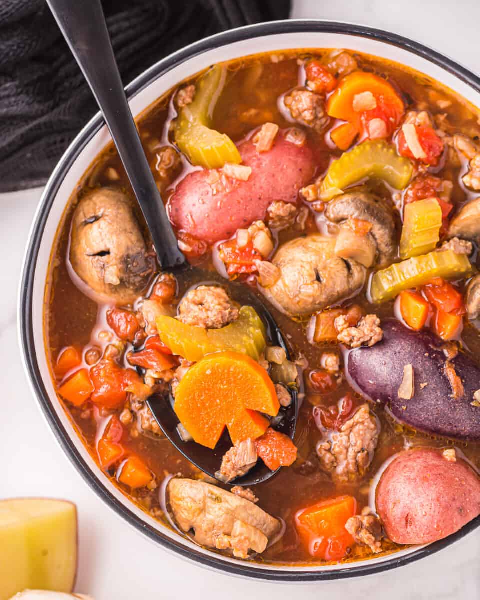 a bowl of Witch's Brew Stew with meat, vegetables and potatoes.